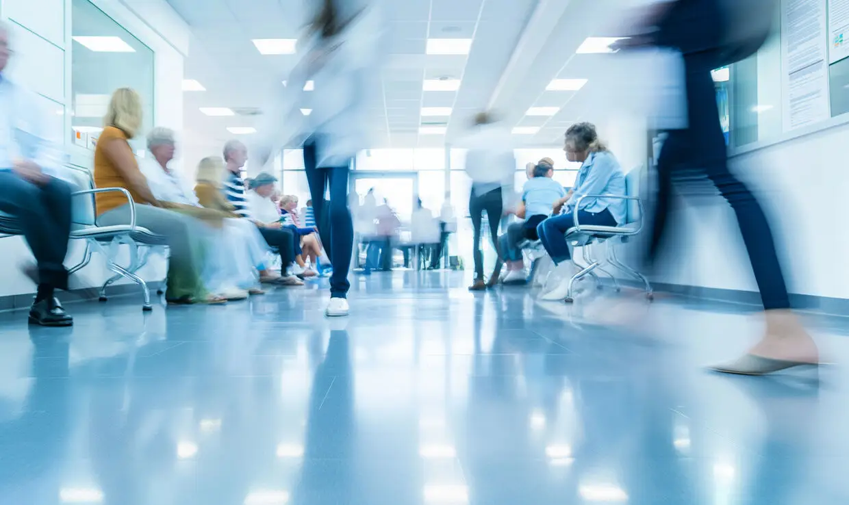 Healthcare worker reviewing patient eligibility documentation