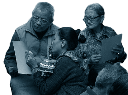 Three people reading a flyer